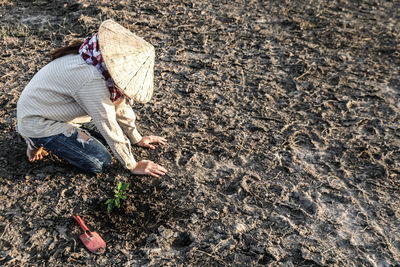 High angle view of woman working on field