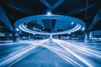 Light trails on road in city at night