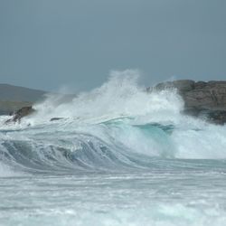 Waves breaking against sea