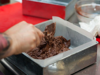 Making a pan of brownies.