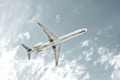 Low angle view of airplane flying in sky