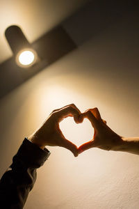 Close-up of heart shape on illuminated lamp