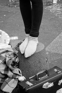 Low section of woman standing on ground