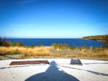 Scenic view of sea against clear blue sky