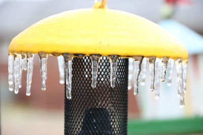 Close-up of icicles on metal