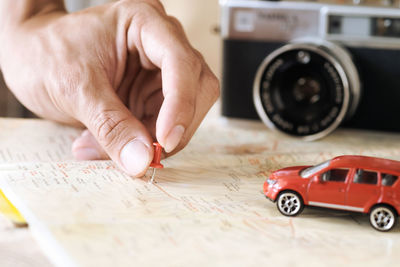 Close-up of hand on map