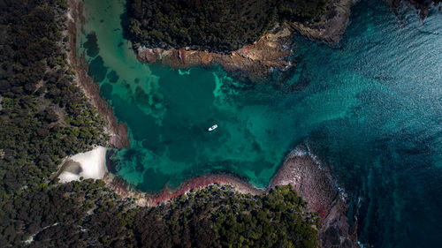 Birds eye drone shot of ocean to inlet in jervis bay national park