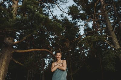 Smiling woman wrapped in towel