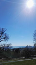 Scenic view of park against blue sky