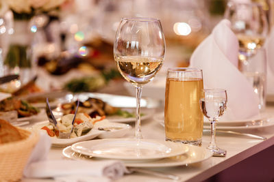 Close-up of wineglasses on table