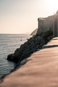 Scenic view of sea against clear sky during sunset