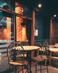 Empty chairs and table in restaurant