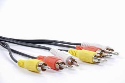 Close-up of colorful computer cables over white background