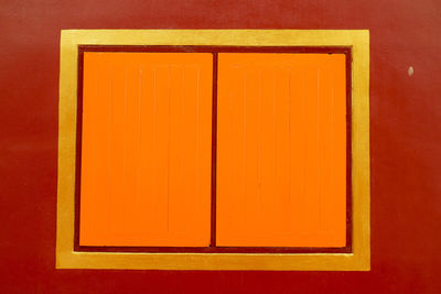 Close-up of orange door