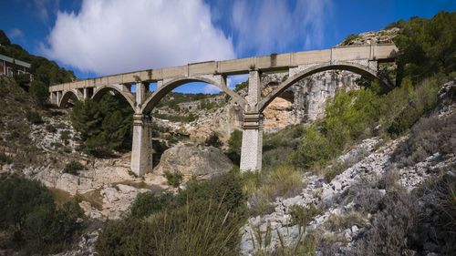 Bridge over river against sky