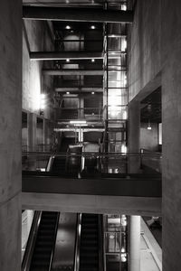 Escalator, concrete, and glass in a futuristic underground station in heumarkt cologne, germany