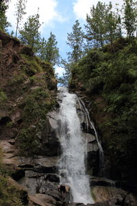 Scenic view of river flowing through rocks