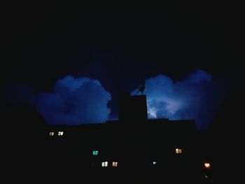 Low angle view of illuminated building against sky