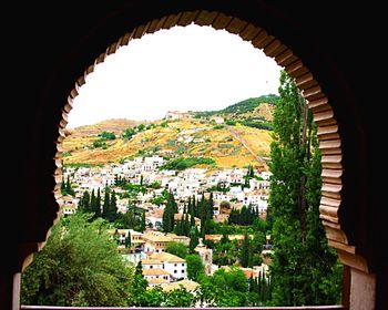 View of town with mountain range in background