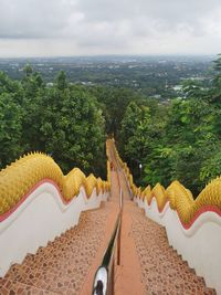 High angle view of buildings against cloudy sky