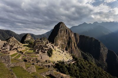 Ruins of a mountain against cloudy sky