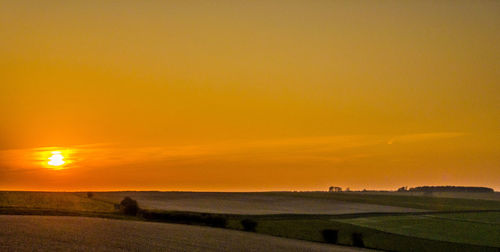 Scenic view of sunset over land