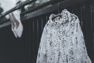 Close-up of clothes hanging on rack in store