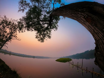 Scenic view of lake against sky during sunset