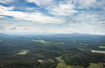 Mountain horizon coverd with cloud layers and forests