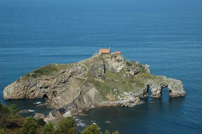 High angle view of rock formations on sea