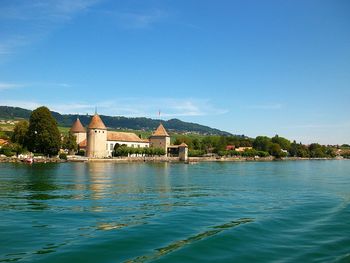 Scenic view of river against blue sky