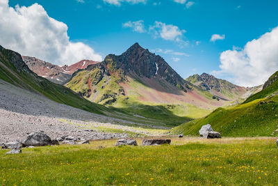 Scenic view of landscape and mountains against sky