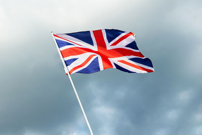 Low angle view of flag against sky