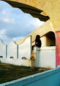 Full length of woman standing against sky