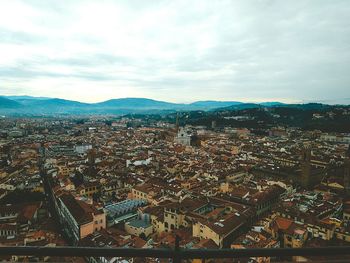 High angle view of city against cloudy sky