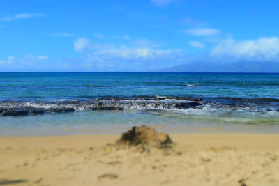 Scenic view of sea against cloudy sky