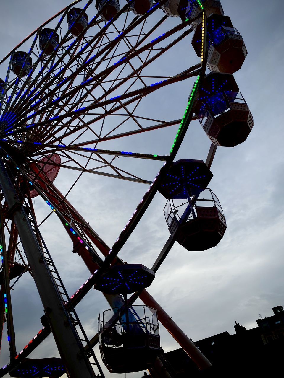 LOW ANGLE VIEW OF WHEEL AGAINST SKY