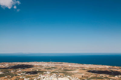 Scenic view of blue sea against sky on sunny day