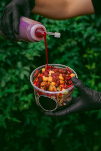 Cropped hand of person preparing food