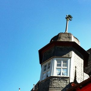 Low angle view of built structure against blue sky