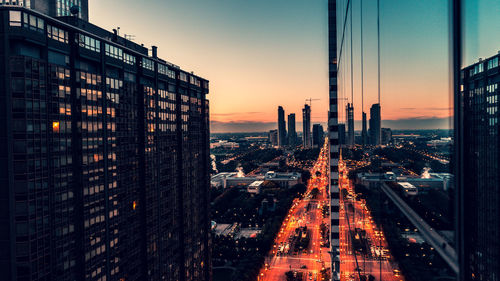 High angle view of buildings against sky during sunset