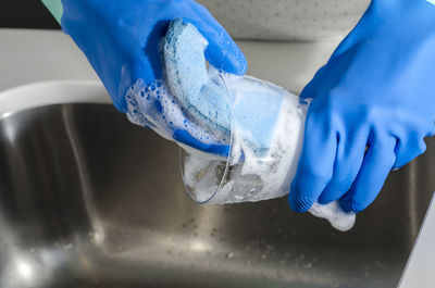 Close-up of human hand holding water