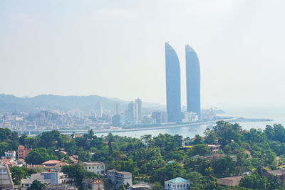 View of buildings in city against sky