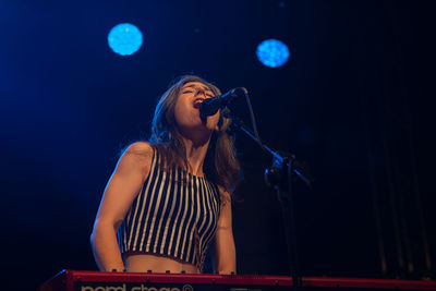 Full length of child playing on stage