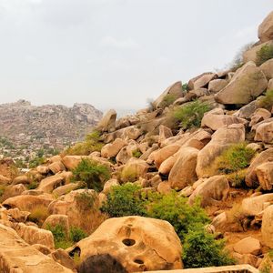 Rock formations on landscape against sky