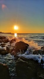 Scenic view of sea against sky during sunset