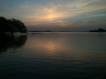 Scenic view of lake against sky during sunset