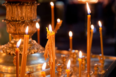 The peaceful ambiance created by candles enhances a tranquil religious setting in a church