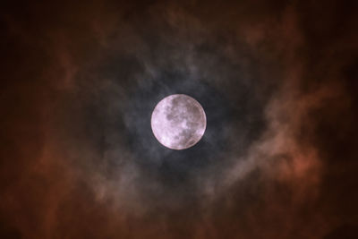 Low angle view of moon against sky at night