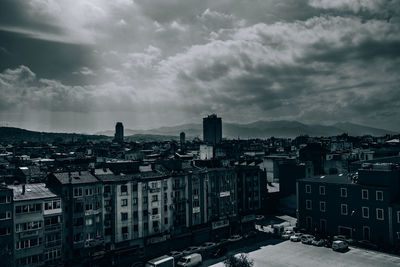 High angle view of buildings in city against sky